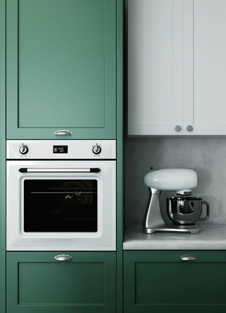 dark green kitchen cabinets in kitchen with stainless steel appliances.